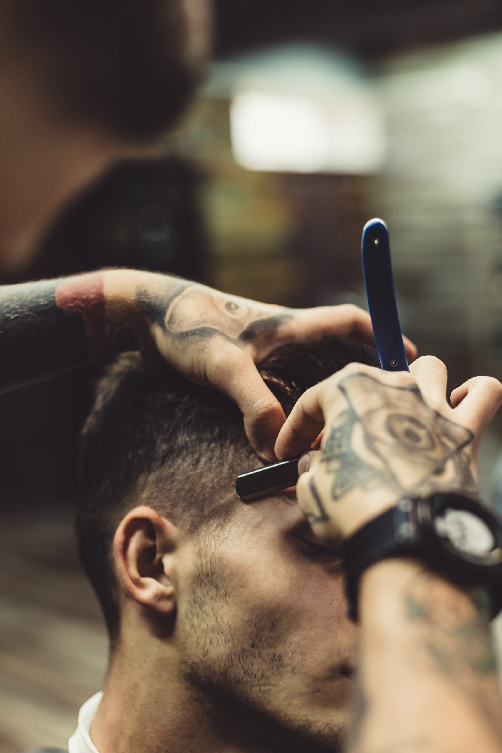 crop-stylish-applying-foam-customer-s-cheeks-shaving-while-working-barbershop-scaled.jpg