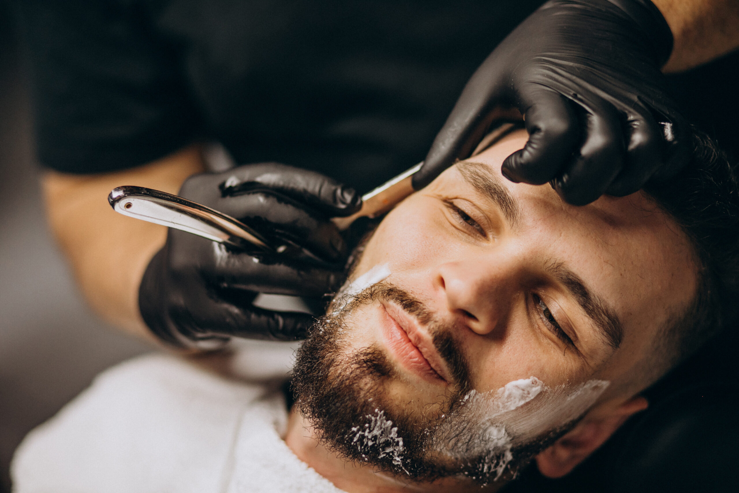 handsome-man-cutting-beard-barber-salon2-scaled.jpg