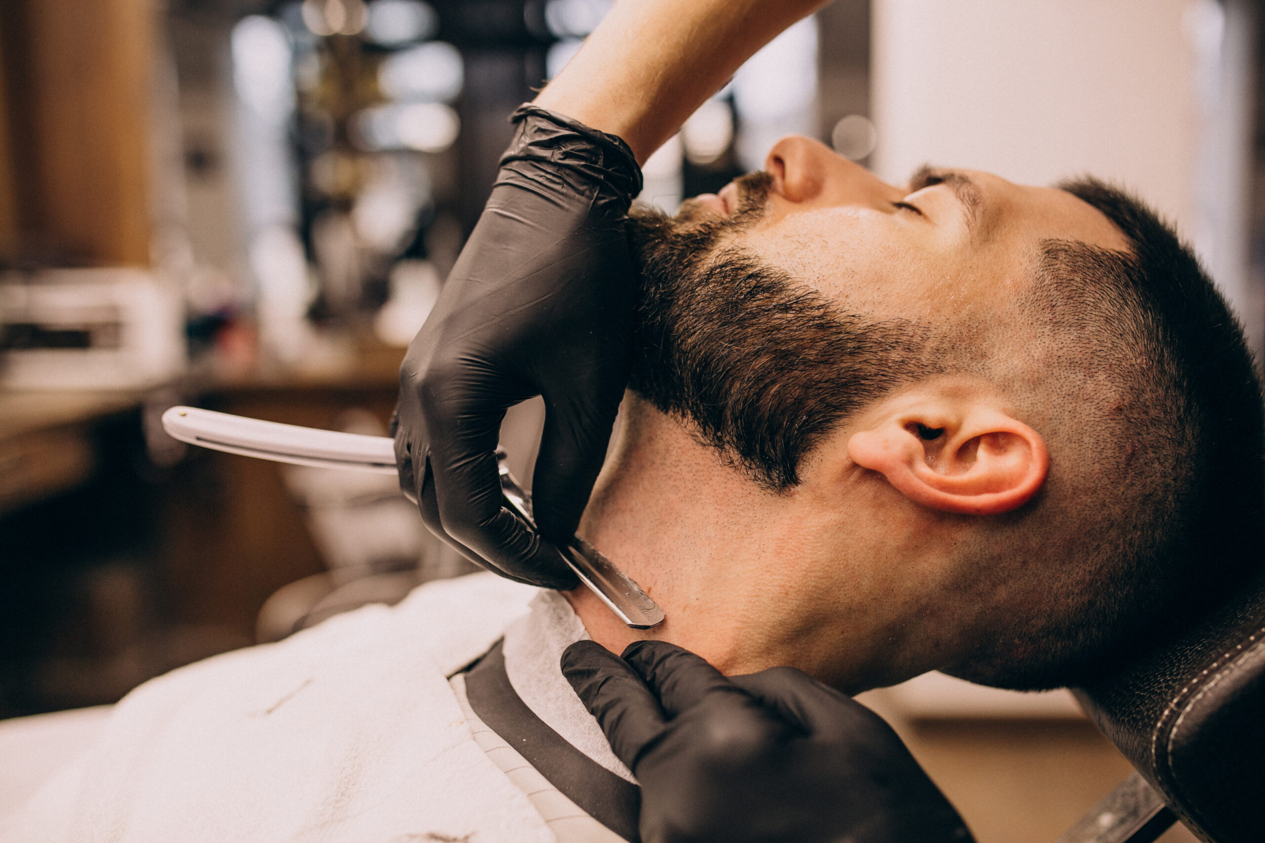 man-barbershop-salon-doing-haircut-beard-trim1-scaled.jpg